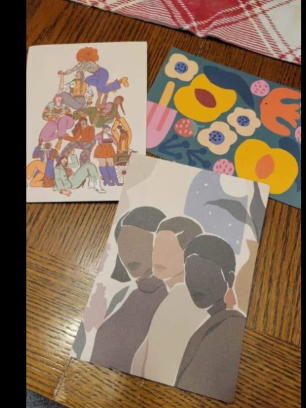 3 new postcards with art work on them